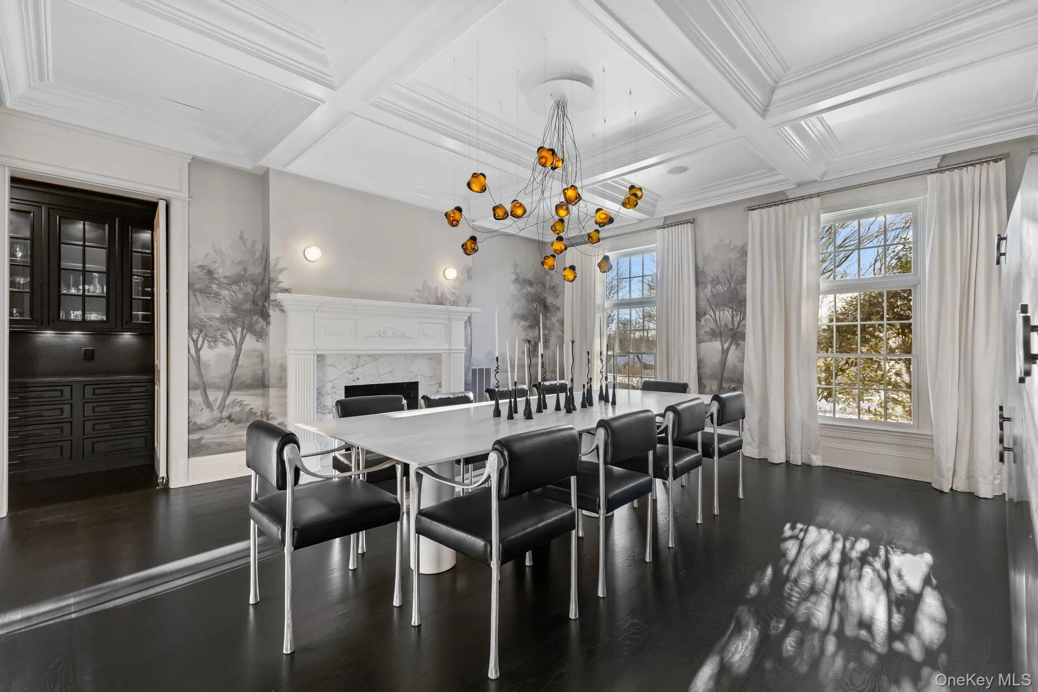 An entertainer’s delight, the dining room seamlessly opens to a fully equipped butler’s pantry for effortless hosting. An entertainer’s delight, the dining room seamlessly opens to a fully equipped butler’s pantry for effortless hosting.