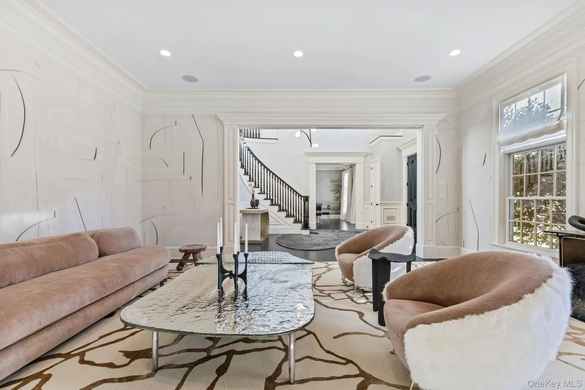 Gorgeous custom windows with transoms above, soaring 10-foot ceilings, and expansive door openings enhance the home’s airy, inviting atmosphere throughout. Gorgeous custom windows with transoms above, soaring 10-foot ceilings, and expansive door openings enhance the home’s airy, inviting atmosphere throughout.
