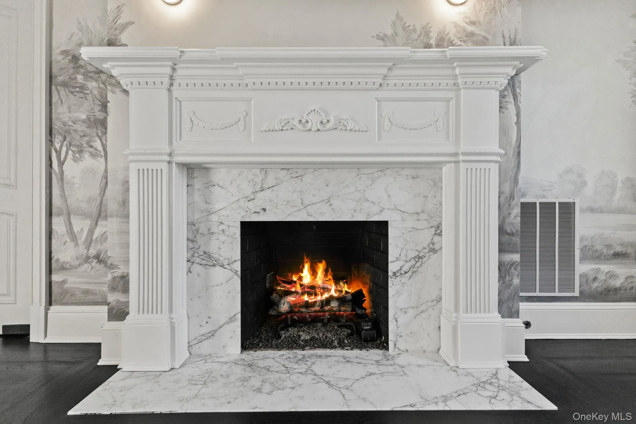 Anchored by a marble-surround fireplace with a custom mantel, your dining experience is elevated to an entirely new level of elegance. Anchored by a marble-surround fireplace with a custom mantel, your dining experience is elevated to an entirely new level of elegance.