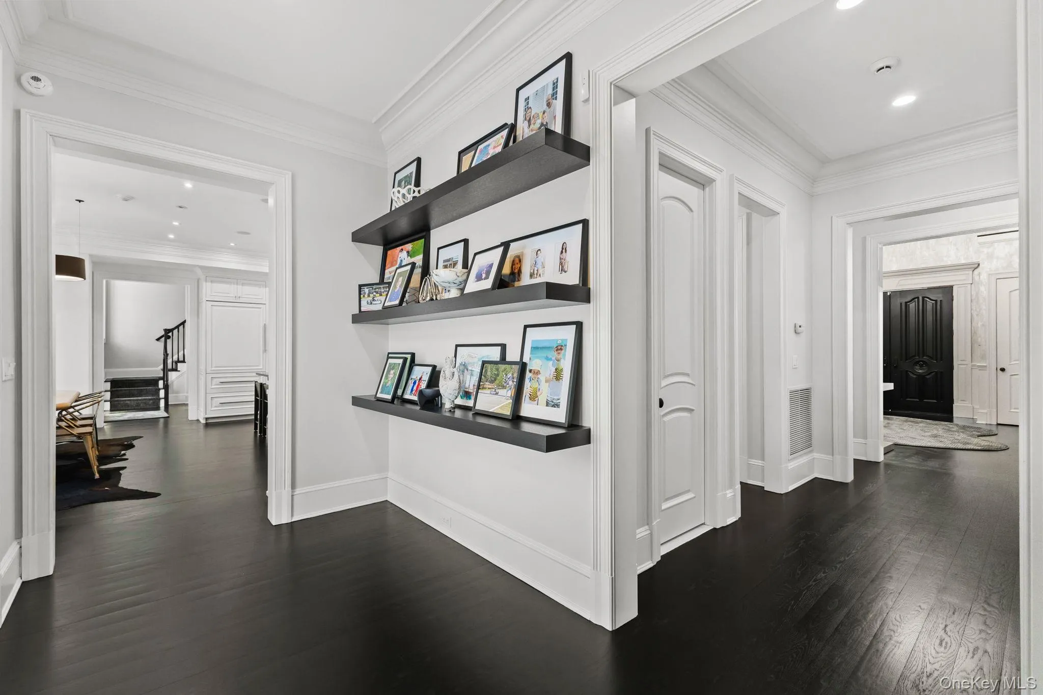 A true testament to this high-end custom-built home, the breezeway showcases bespoke shelving, multiple closets, and two sets of French doors at each end, blending functionality with refined architectural detail. A true testament to this high-end custom-built home, the breezeway showcases bespoke shelving, multiple closets, and two sets of French doors at each end, blending functionality with refined architectural detail.