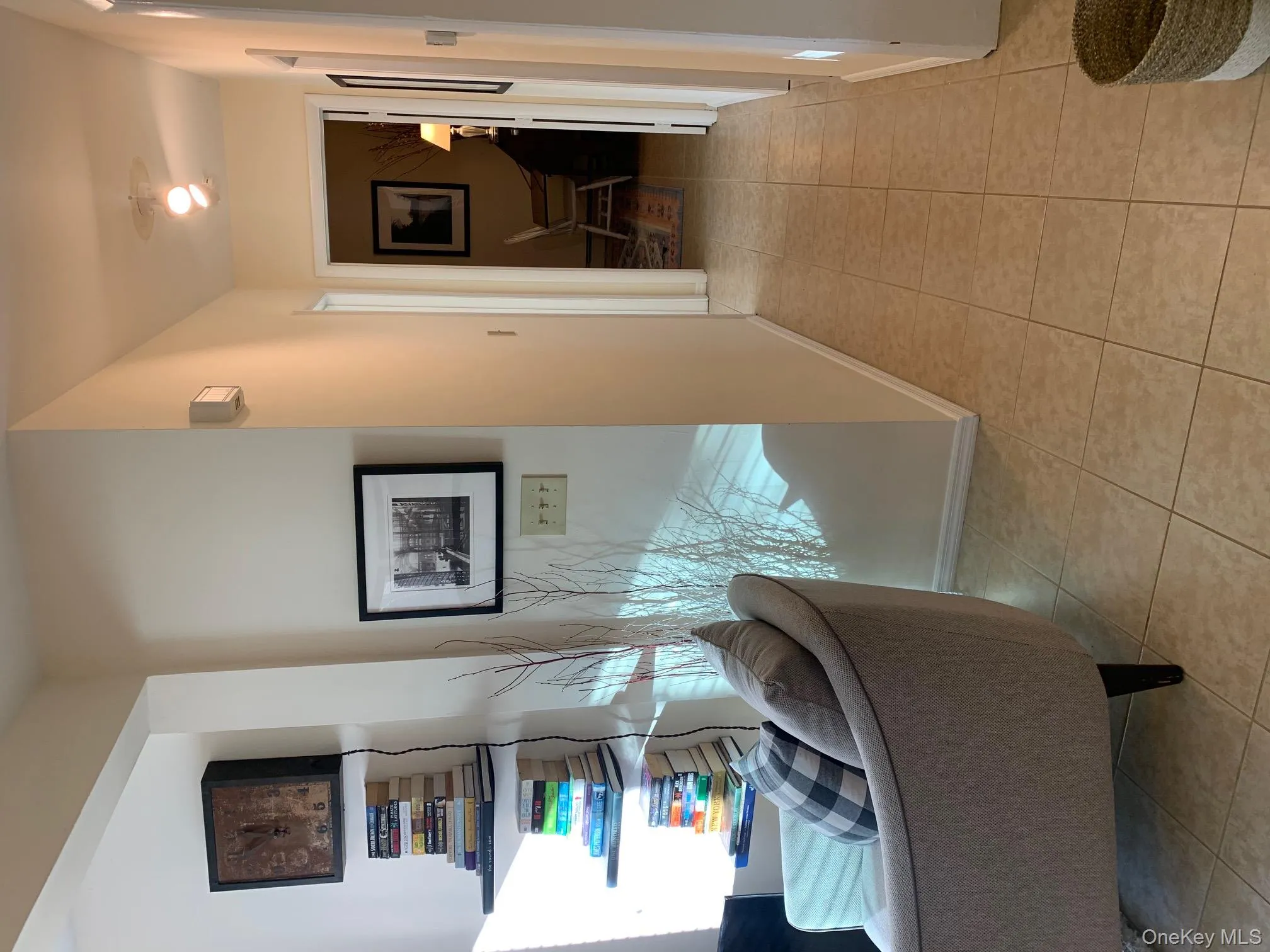 Corridor featuring light tile patterned flooring Corridor featuring light tile patterned flooring