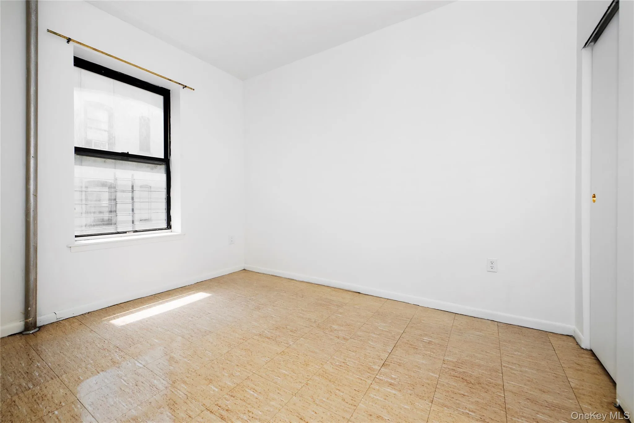 Second Bedroom, facing south with closet and light floors Second Bedroom, facing south with closet and light floors