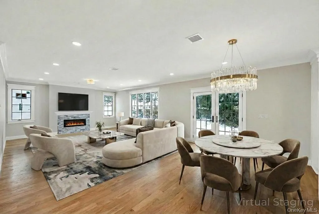 Open layout dining and living room with fireplace Open layout dining and living room with fireplace