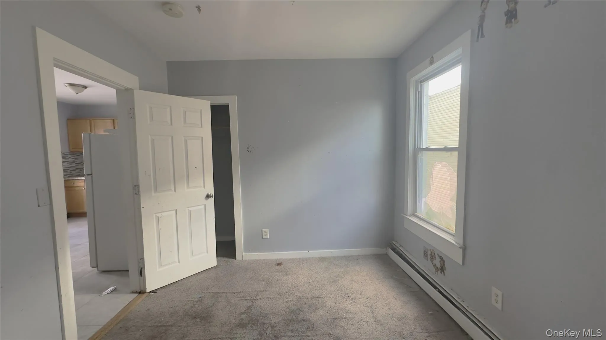 Carpet flooring, baseboard heating, light fixture, closet. Carpet flooring, baseboard heating, light fixture, closet.