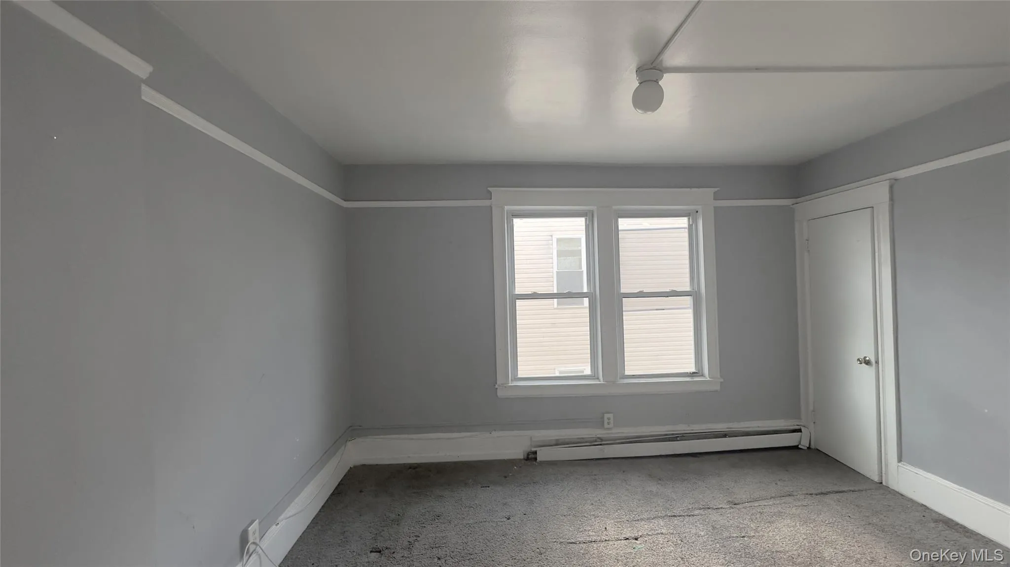 Carpet flooring, baseboard heating, light fixture, closet. Carpet flooring, baseboard heating, light fixture, closet.