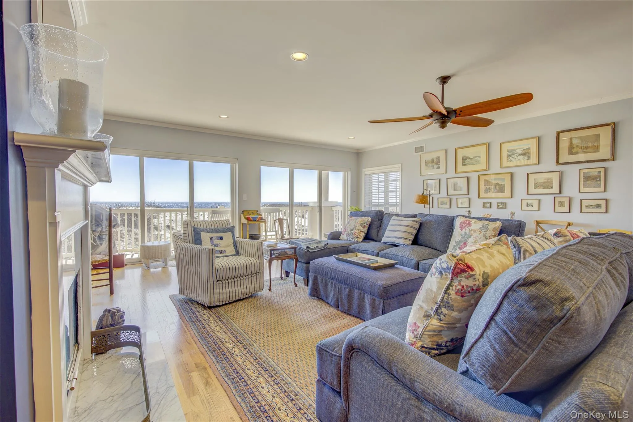 Living room featuring visible vents, ornamental molding, wood finished floors, recessed lighting, and a ceiling fan Living room featuring visible vents, ornamental molding, wood finished floors, recessed lighting, and a ceiling fan