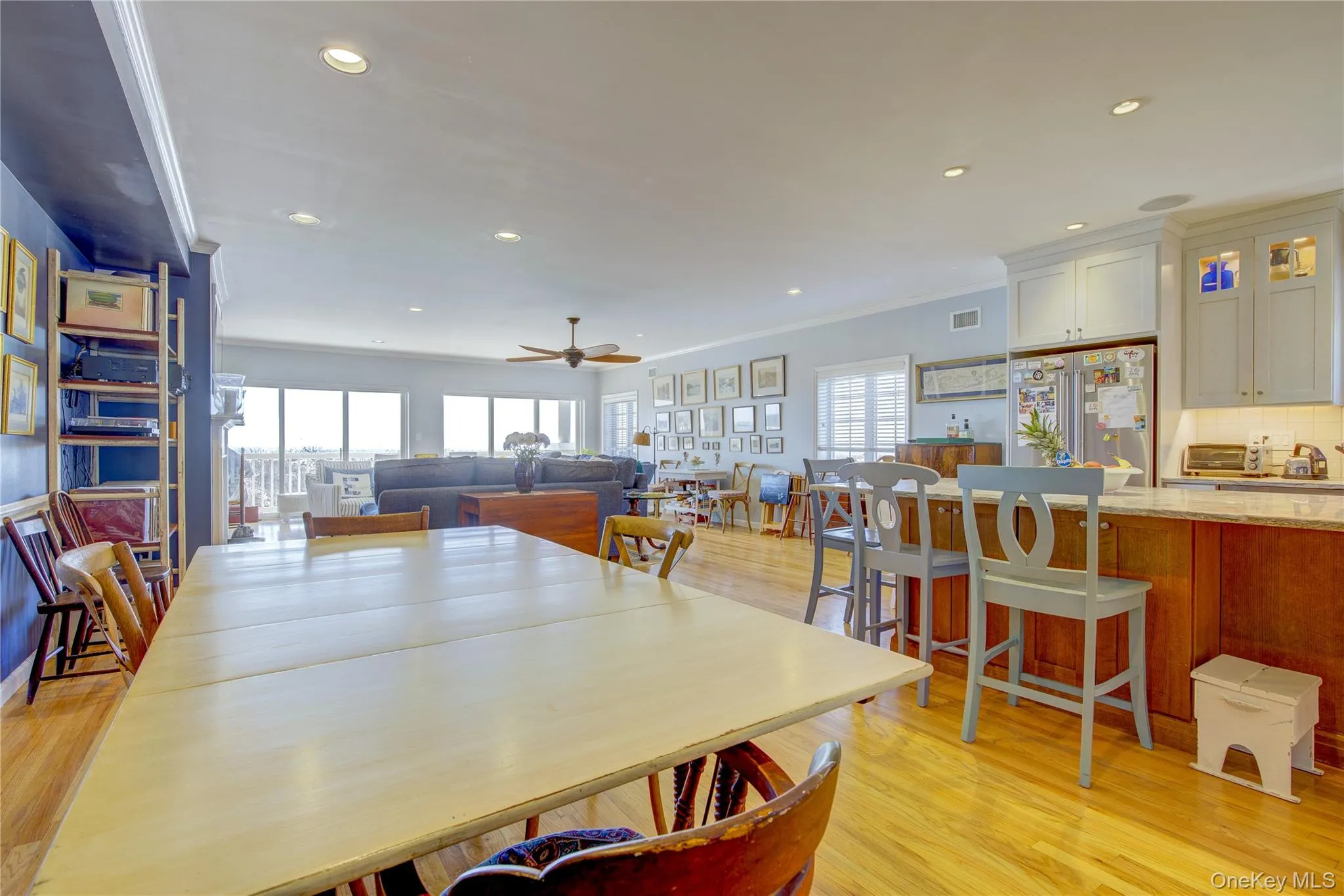 Dining area featuring ornamental molding, visible vents, light wood-style floors, ceiling fan, and recessed lighting Dining area featuring ornamental molding, visible vents, light wood-style floors, ceiling fan, and recessed lighting