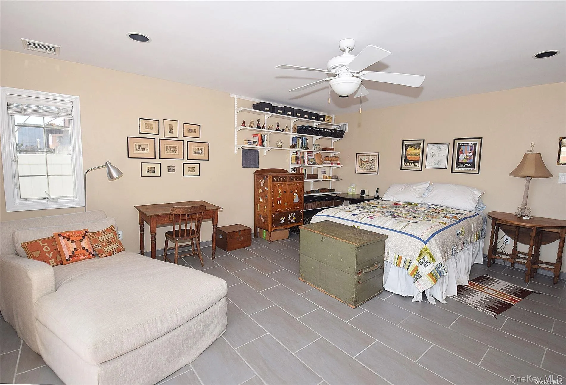 Tiled bedroom featuring ceiling fan Tiled bedroom featuring ceiling fan