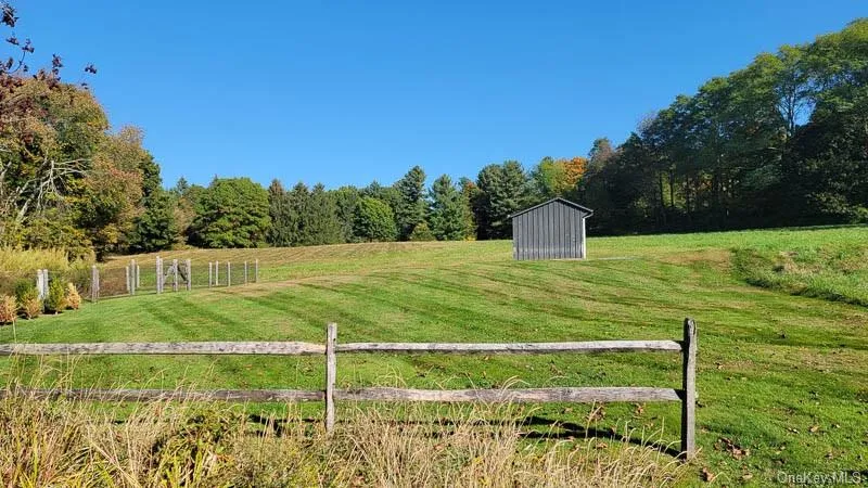 Back meadow leads to upper meadow with a garage and shed. Back meadow leads to upper meadow with a garage and shed.