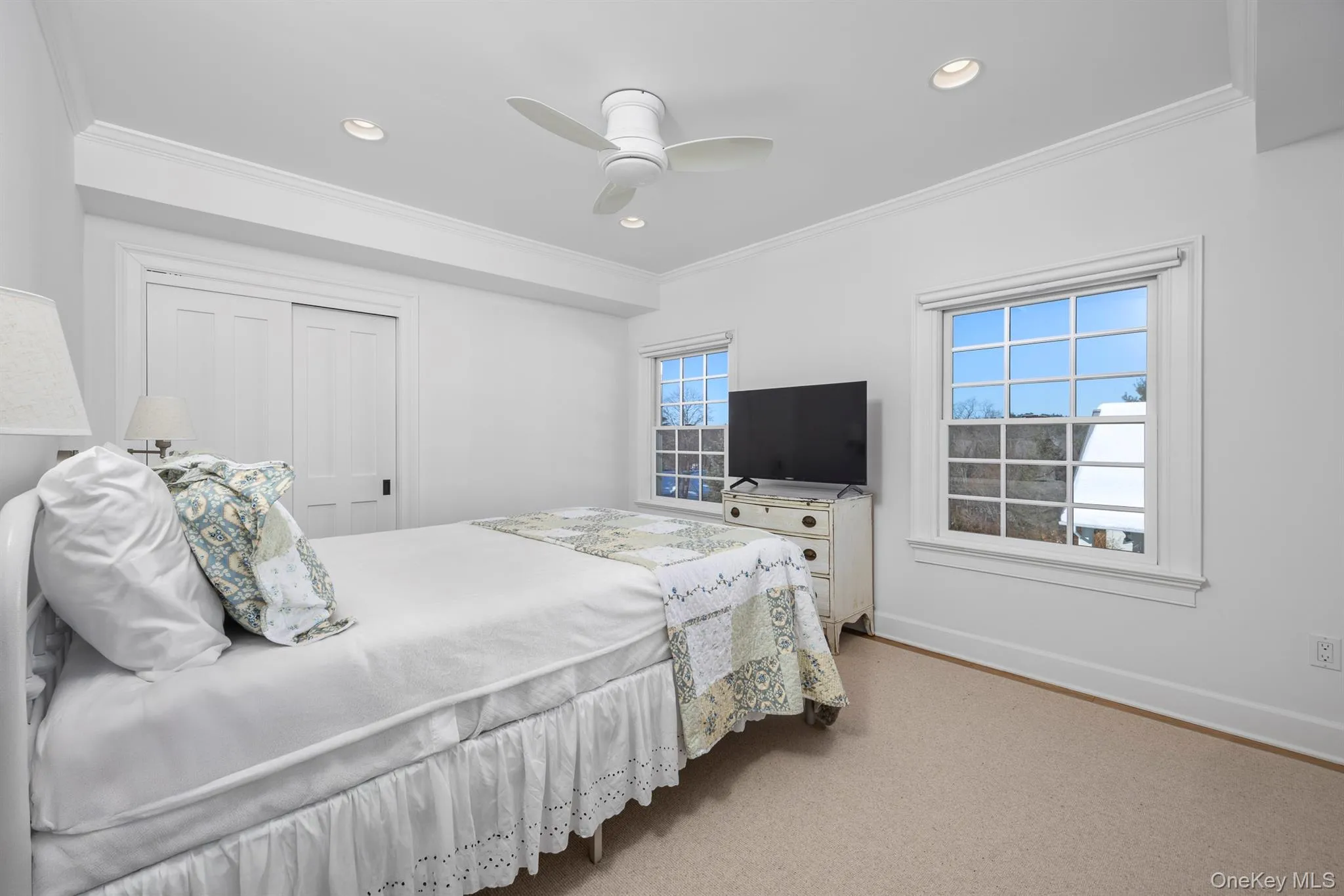 Second floor bedroom overlooks yard with pool house. Second floor bedroom overlooks yard with pool house.