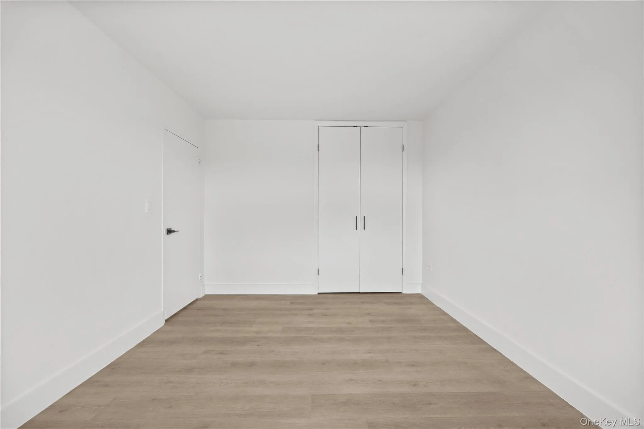 Bedroom # 1 with closet and vinyl plank floors Bedroom # 1 with closet and vinyl plank floors