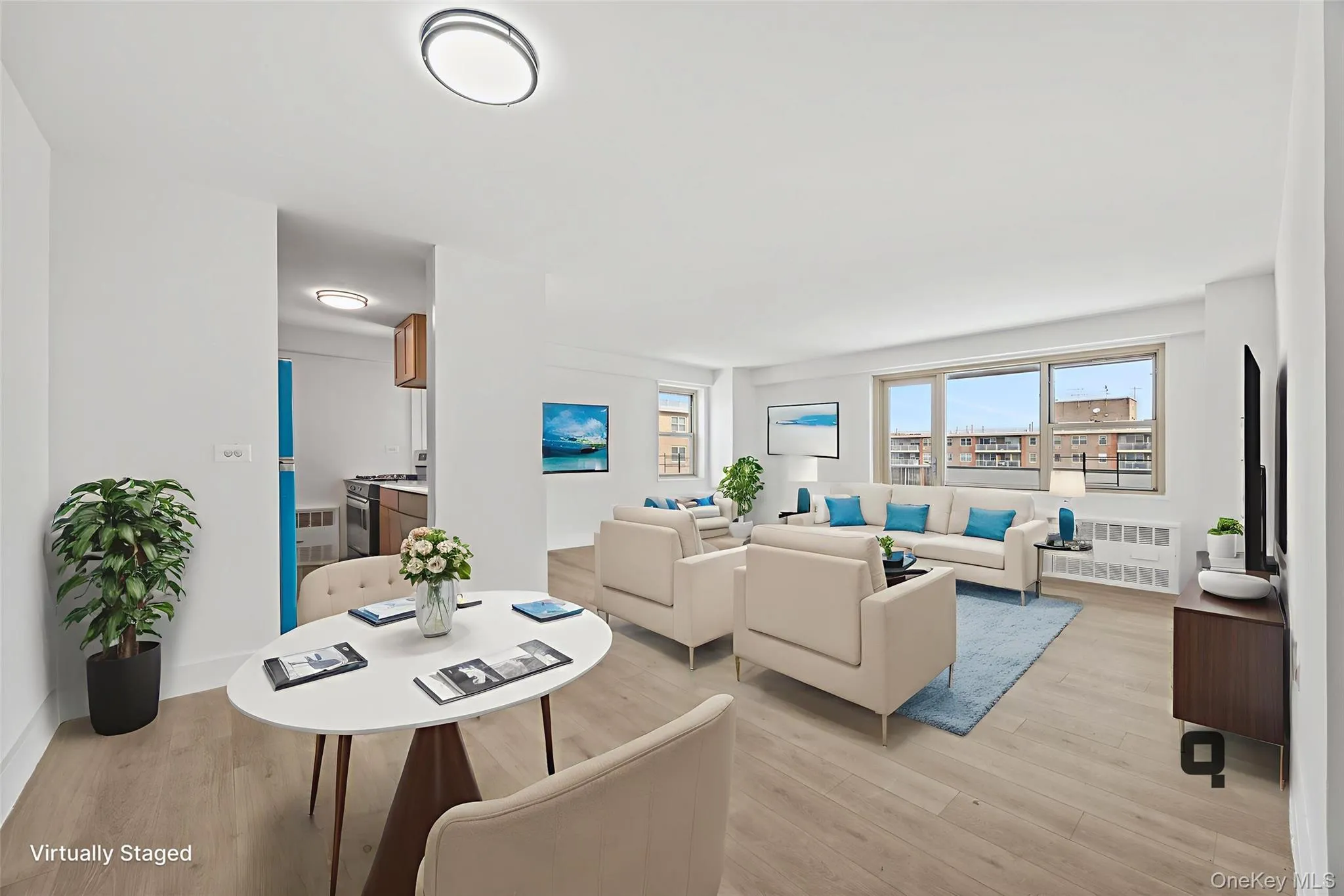 Virtually staged dining and living area Virtually staged dining and living area