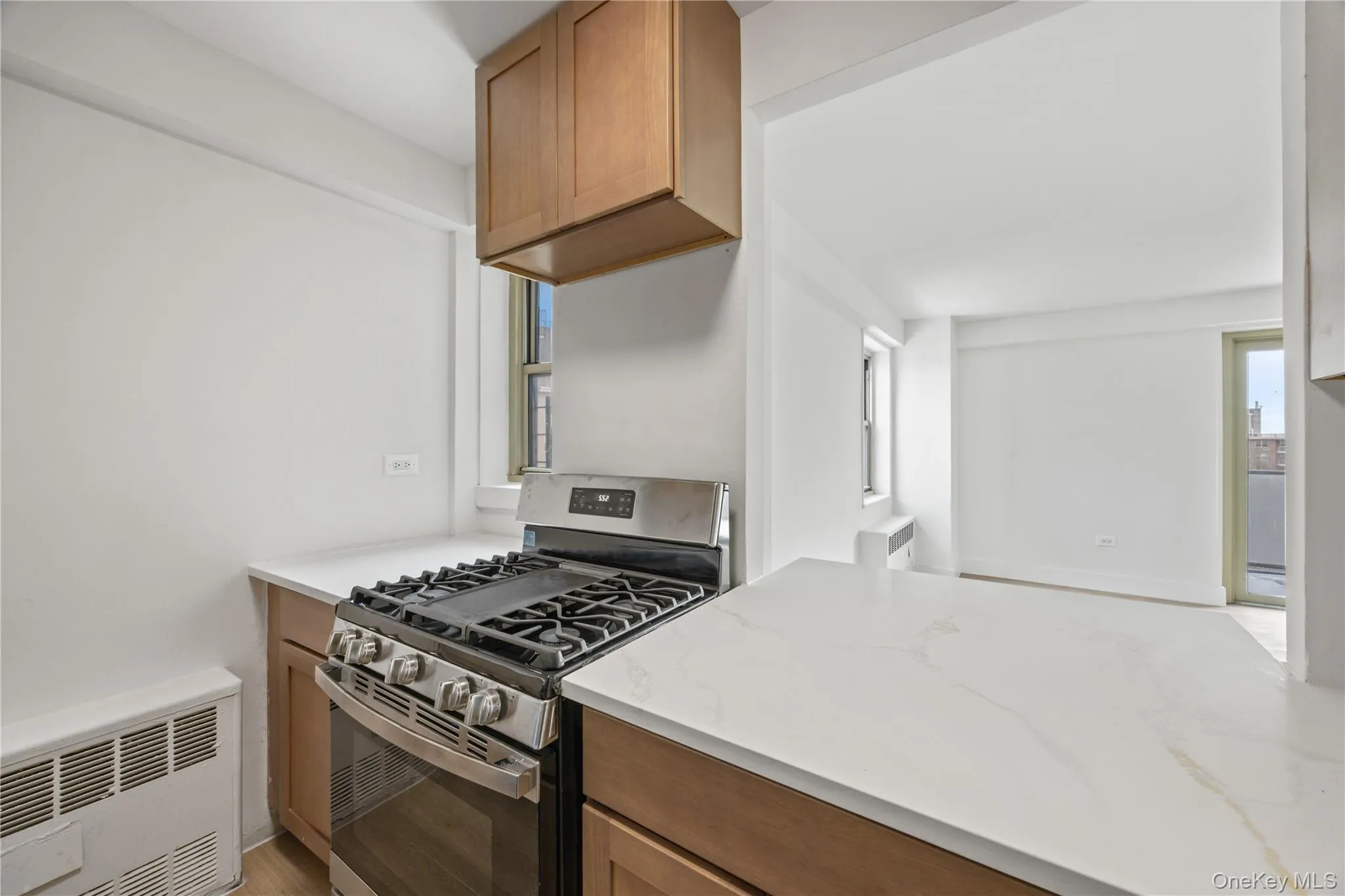 Kitchen with new appliances, neutral cabinetry and quartz counter tops Kitchen with new appliances, neutral cabinetry and quartz counter tops