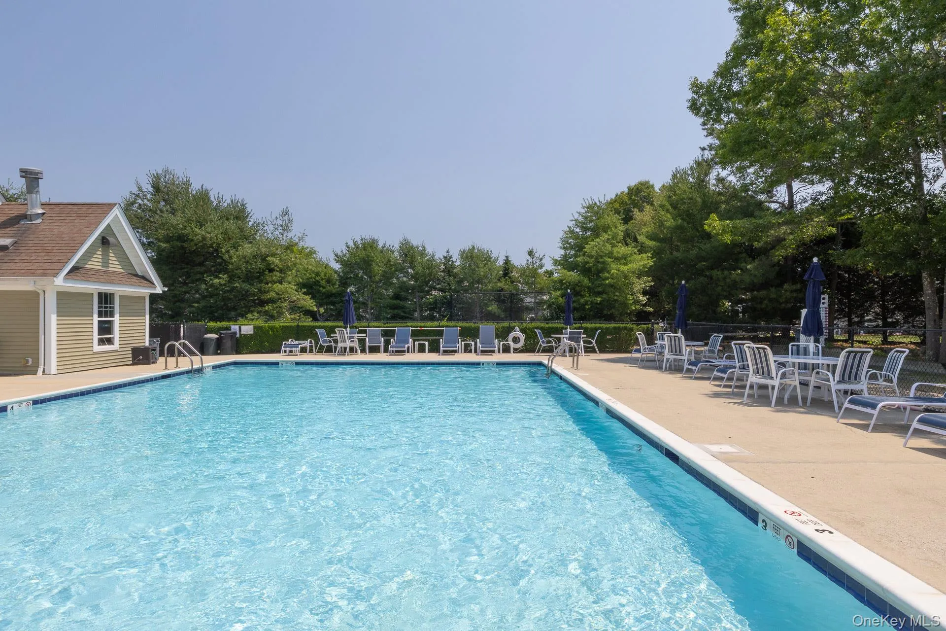 Outdoor swimming pool outside Clubhouse with concrete decking Outdoor swimming pool outside Clubhouse with concrete decking
