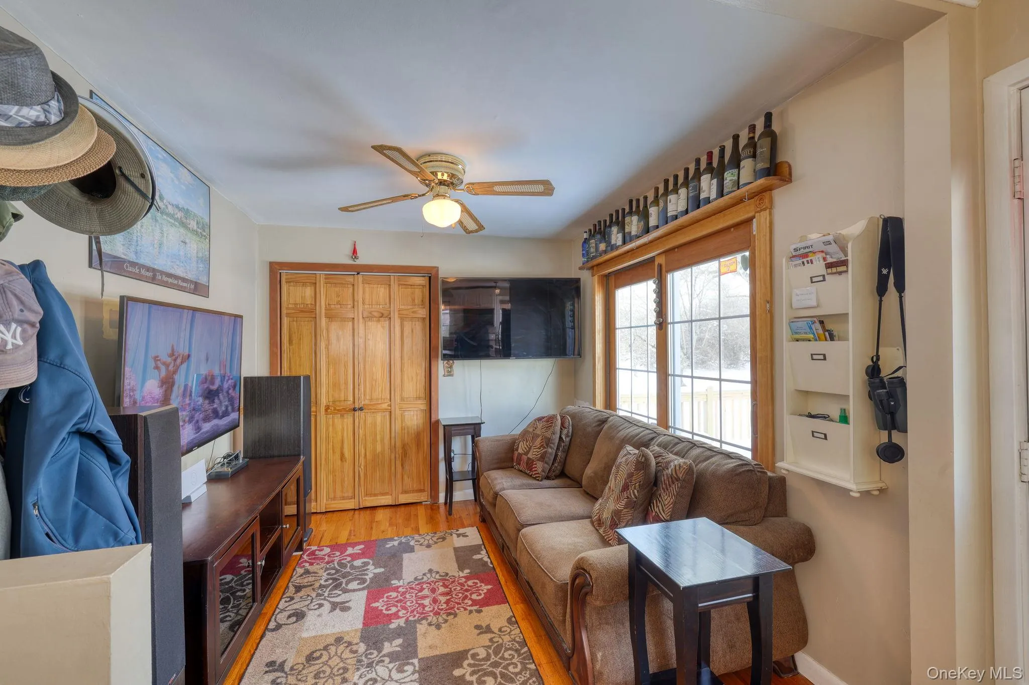 Family/TV room with sliding doors to deck. Family/TV room with sliding doors to deck.