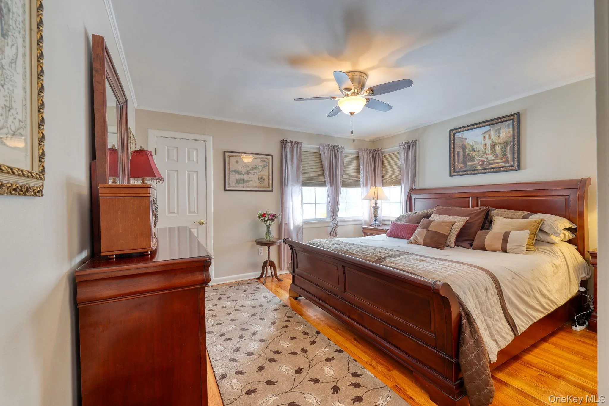 Bright main floor bedroom with king size bed and two closets. Bright main floor bedroom with king size bed and two closets.