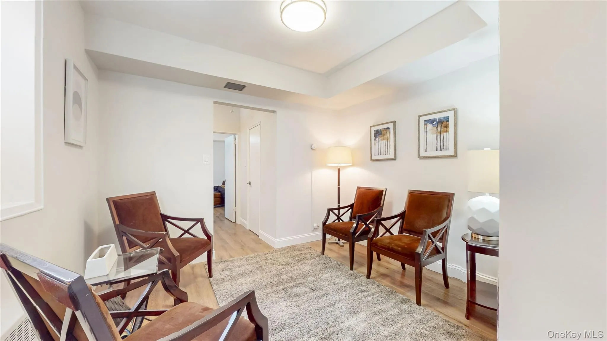 Waiting area featuring light wood finished floors Waiting area featuring light wood finished floors