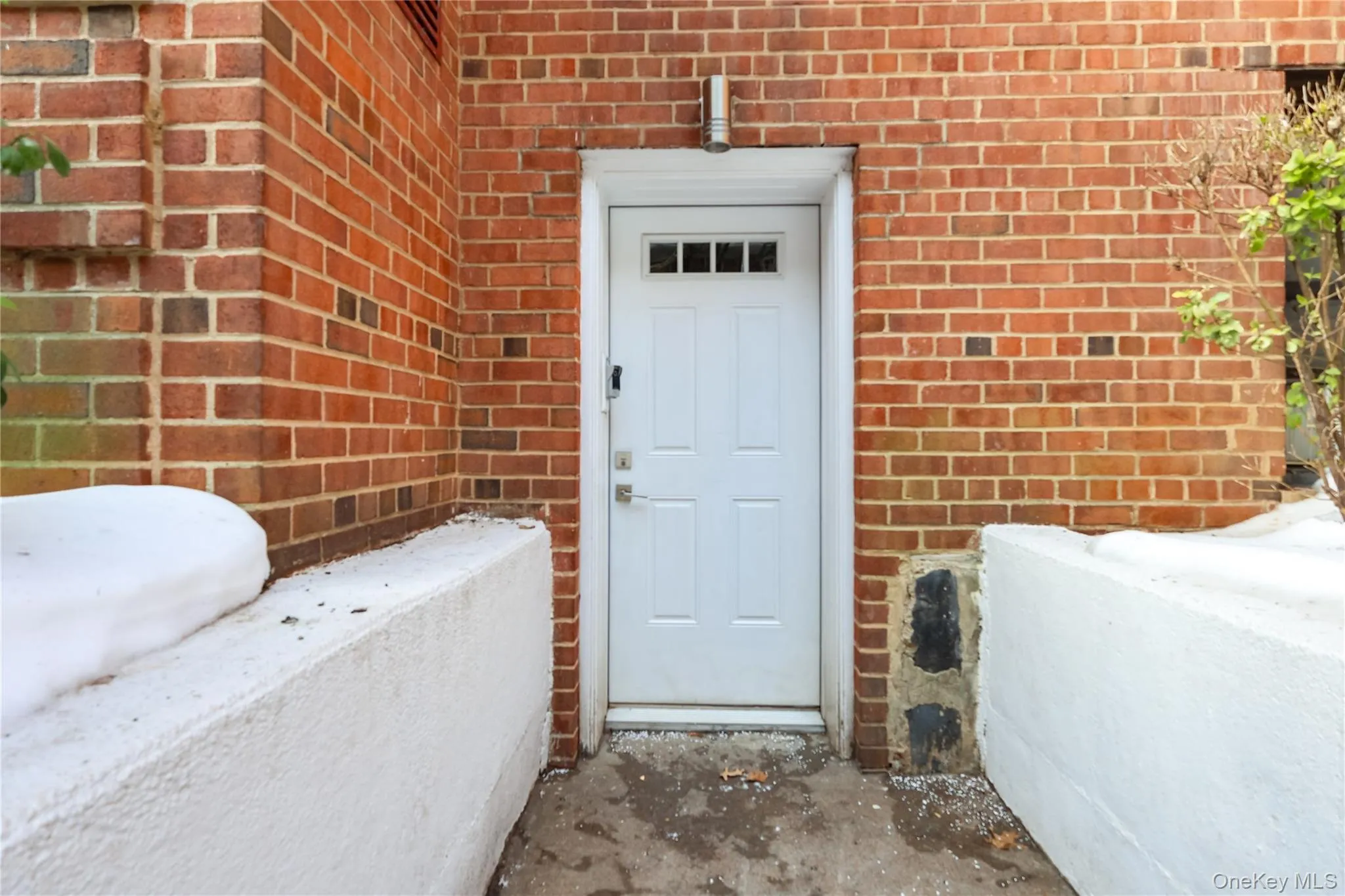 Entrance to property with brick siding Entrance to property with brick siding