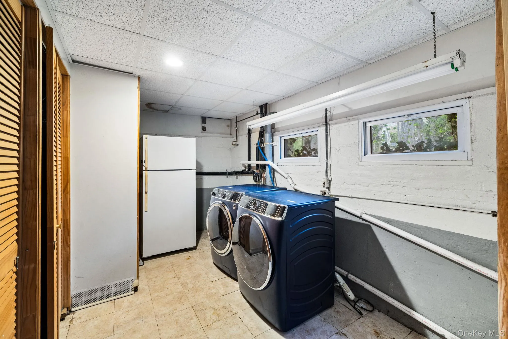 Private Laundry Area and Second Refrigerator. Private Laundry Area and Second Refrigerator.