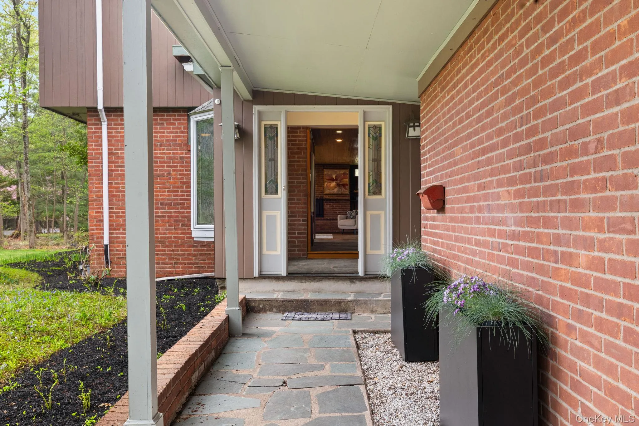 Protected Stone & Brick Walkway from Car/ Garage to Mail and Front Door. Protected Stone & Brick Walkway from Car/ Garage to Mail and Front Door.