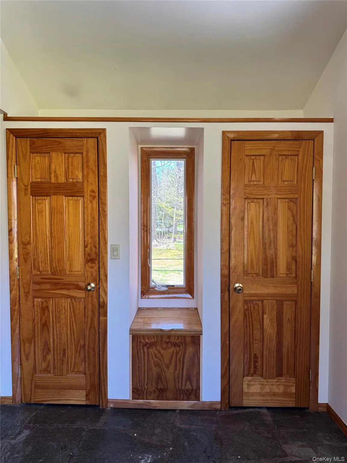 Entry Storage Closets in Foyer w/ Stone Floors and Window Seat w/ Views. Entry Storage Closets in Foyer w/ Stone Floors and Window Seat w/ Views.