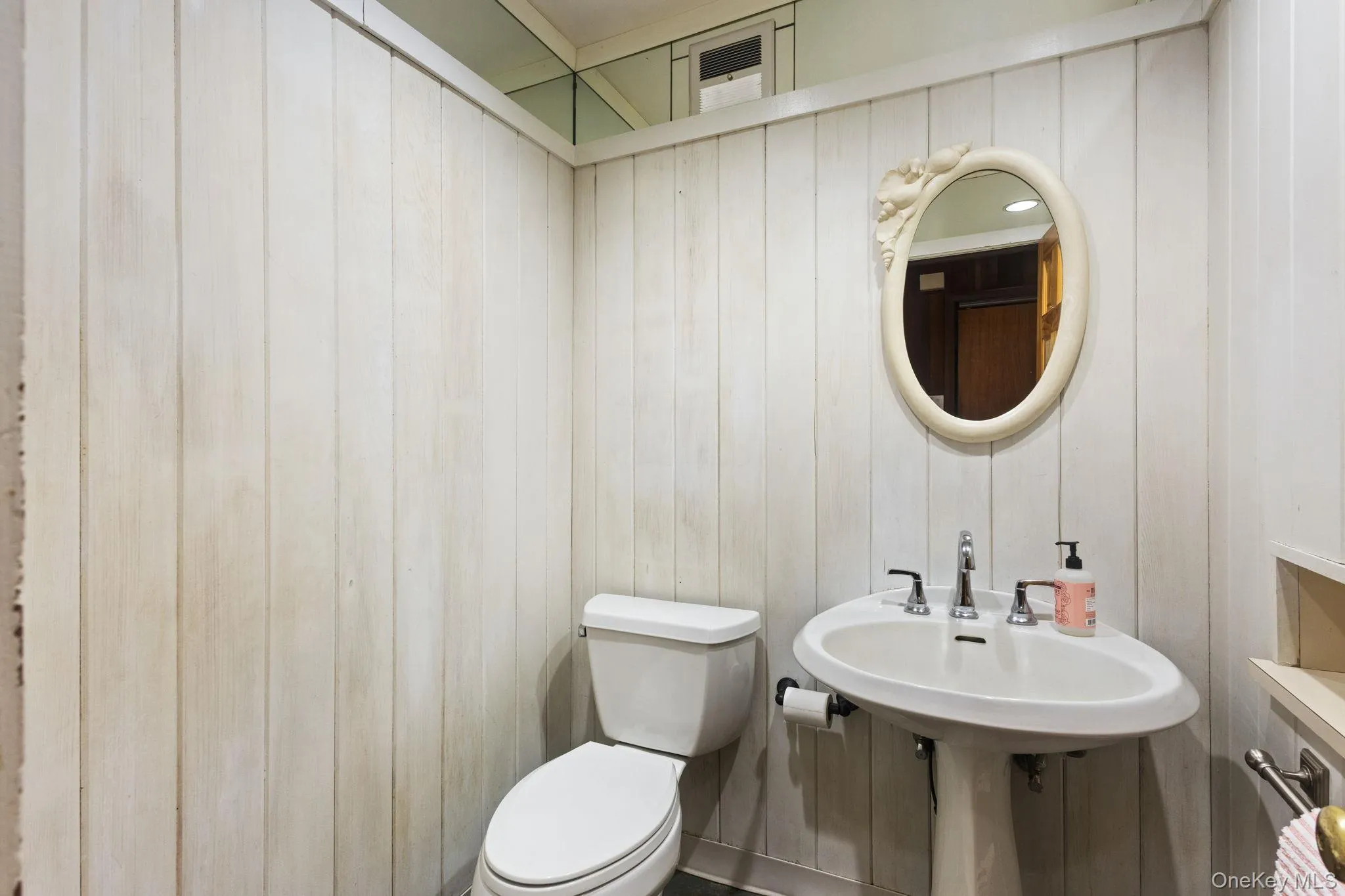 Guest Bathroom/Lavatory in Front Hall for Quick Touch Ups & Privacy. Guest Bathroom/Lavatory in Front Hall for Quick Touch Ups & Privacy.