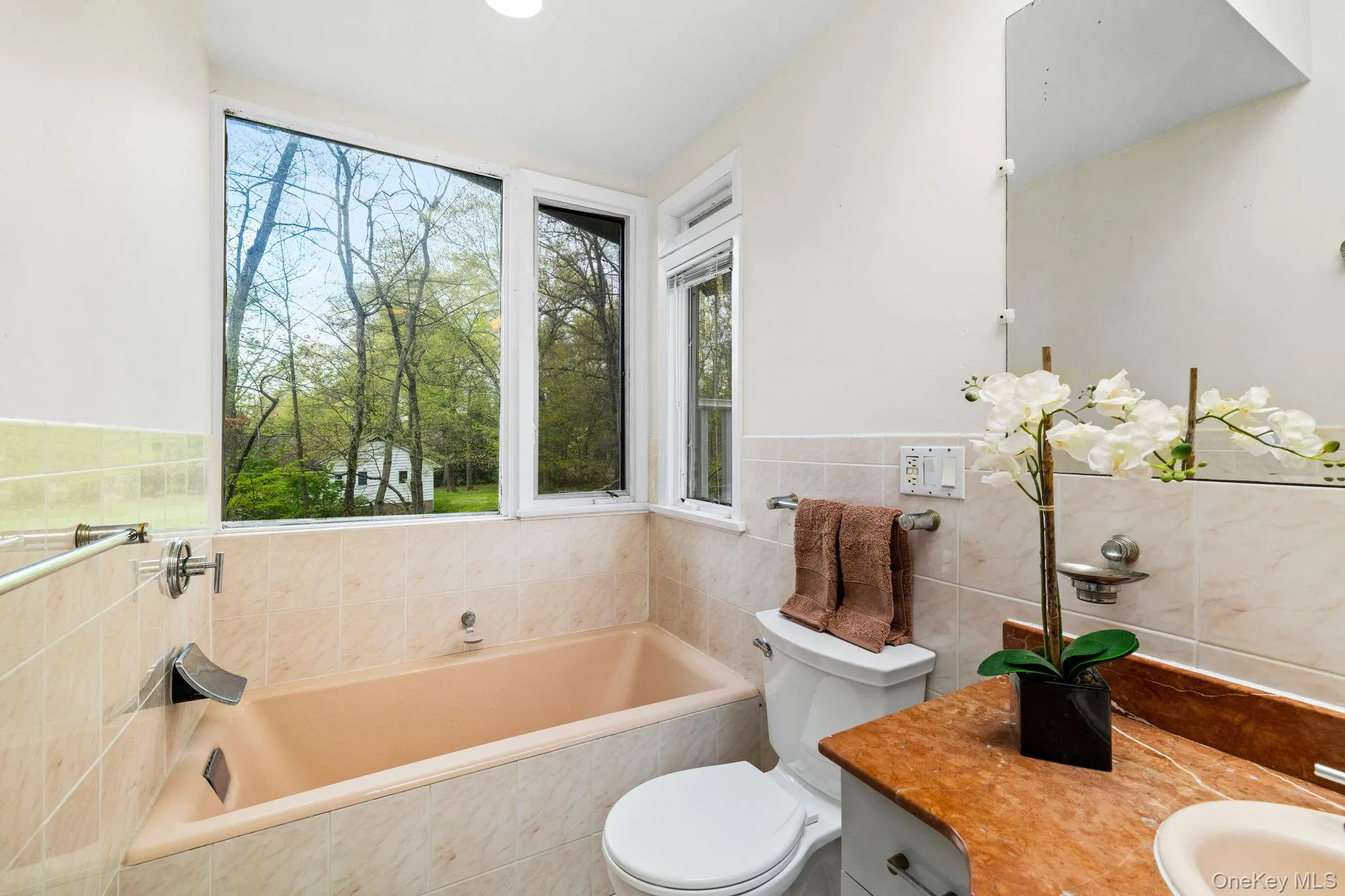 Master Bath withLarge WindowsSurrounding the Soaking Tub. Master Bath withLarge WindowsSurrounding the Soaking Tub.