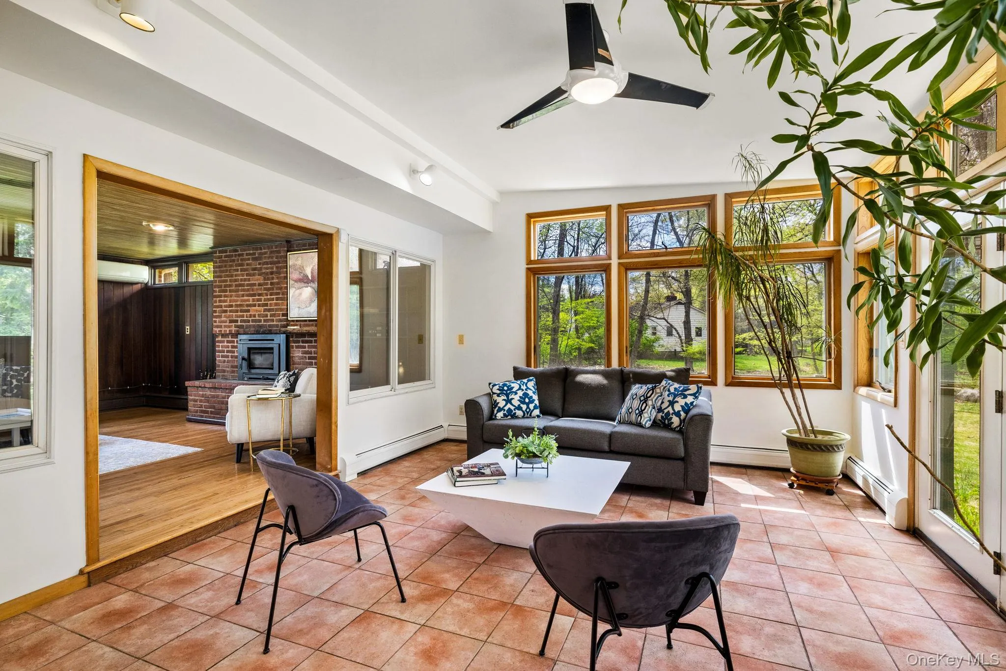 Wall of Windows on all Three Sides, gives Garden Views and Natural Light. Wall of Windows on all Three Sides, gives Garden Views and Natural Light.