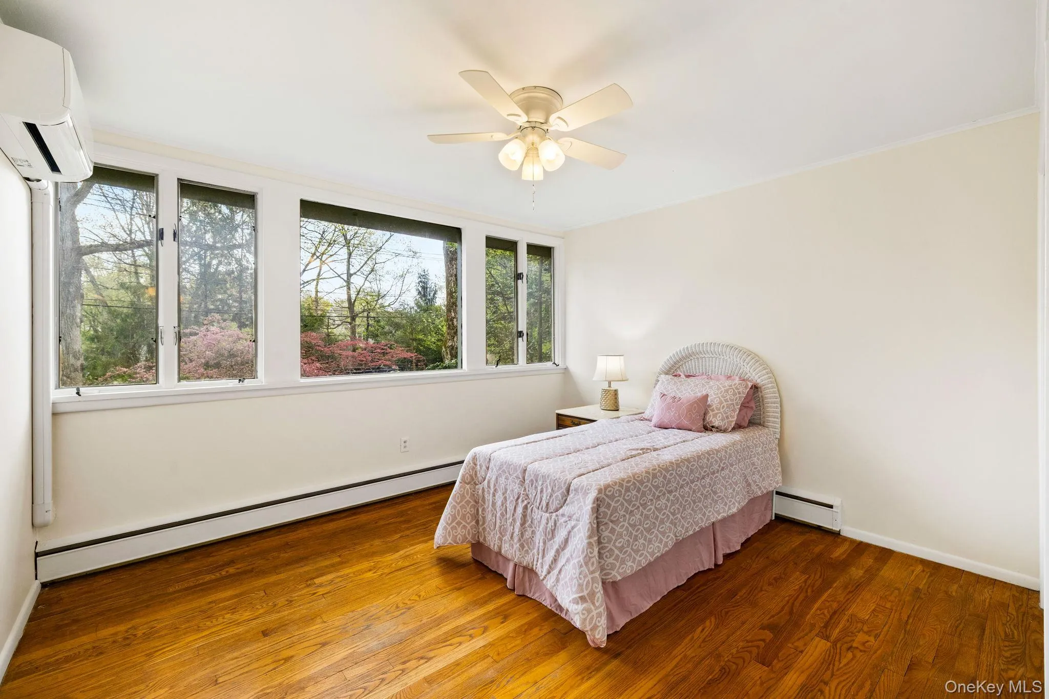 2nd Bedroom with Bank Of Windows, Hardwood Floors and Ceiling Fan. 2nd Bedroom with Bank Of Windows, Hardwood Floors and Ceiling Fan.