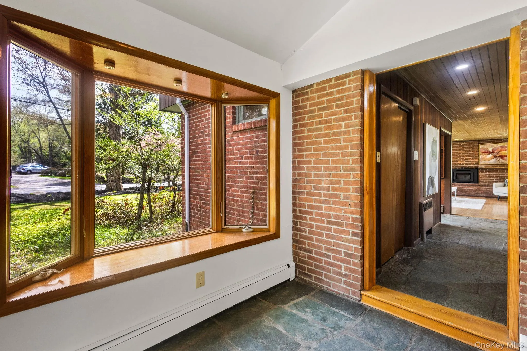 Bay Window with Casements Fresh Air & Light. Stone Floors w/ Brick Accent Walls. Bay Window with Casements Fresh Air & Light. Stone Floors w/ Brick Accent Walls.