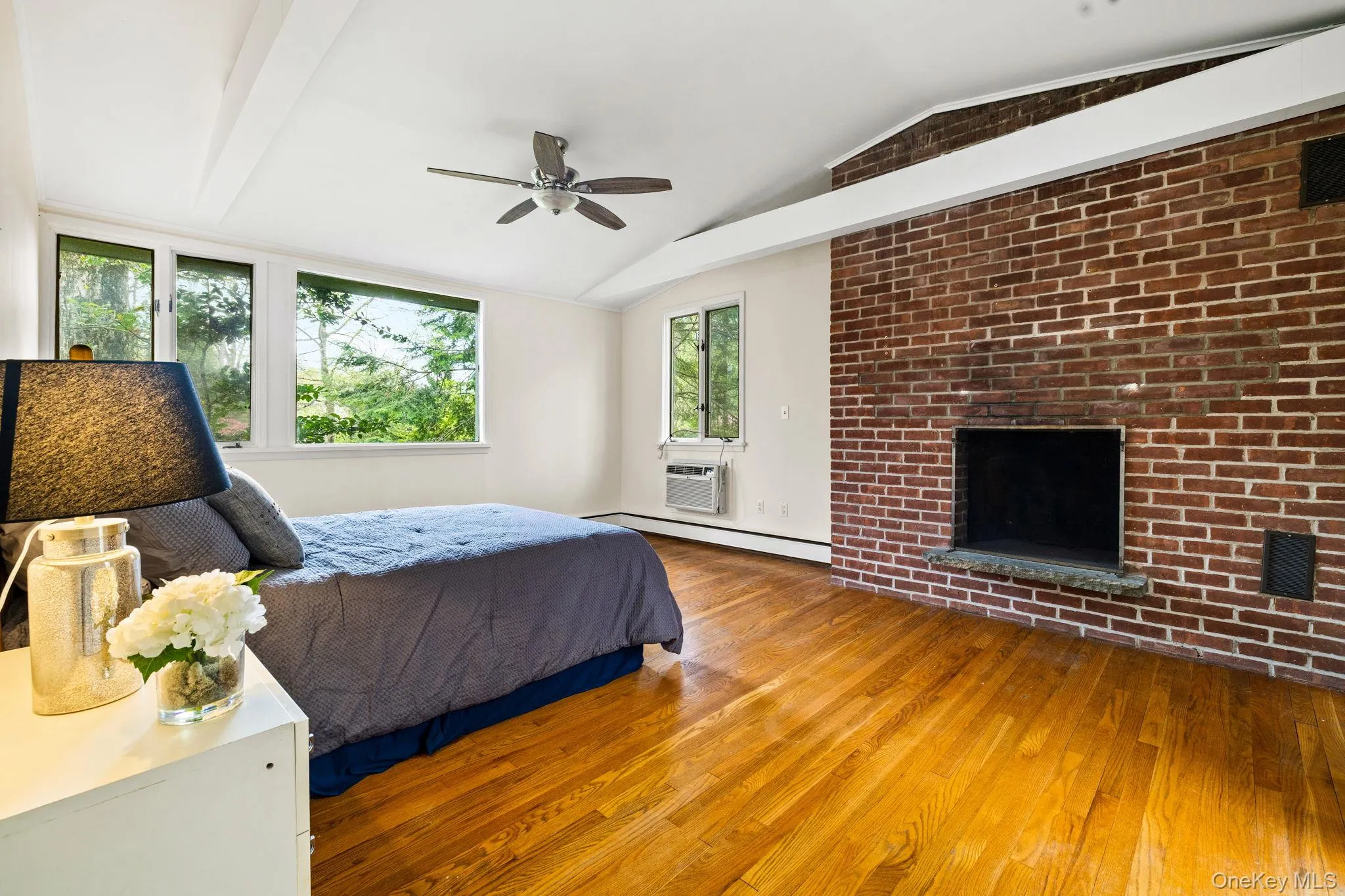 Master Bedroom with Fireplace and Peaked Ceiling w/ En Suite Bathroom & Closets. Master Bedroom with Fireplace and Peaked Ceiling w/ En Suite Bathroom & Closets.
