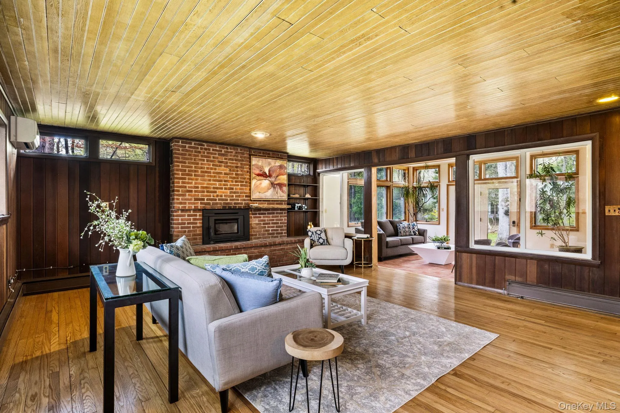 Conversation Pit faces the Wall of WindowsLeading into the Family Room. Conversation Pit faces the Wall of WindowsLeading into the Family Room.