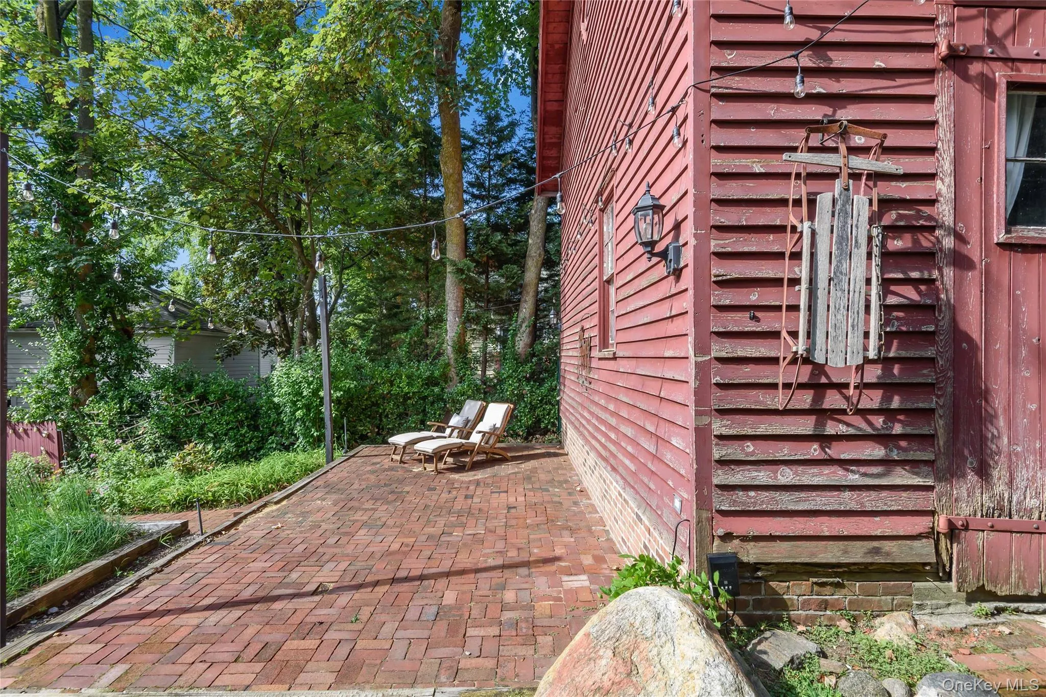 View of side Barn featuring a patio area View of side Barn featuring a patio area