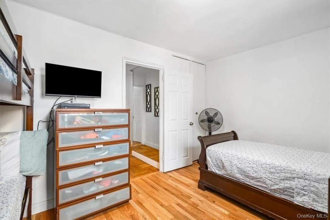 Bedroom with light hardwood / wood-style flooring Bedroom with light hardwood / wood-style flooring