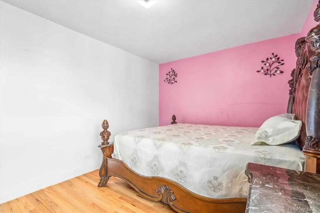 Bedroom featuring hardwood / wood-style floors Bedroom featuring hardwood / wood-style floors