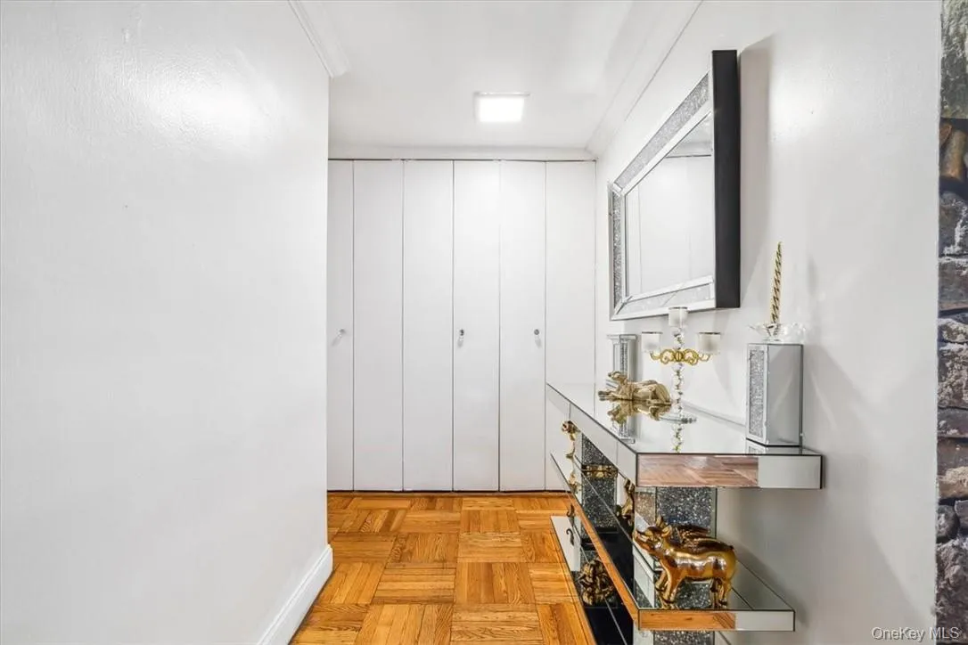 Hall featuring crown molding and light parquet flooring Hall featuring crown molding and light parquet flooring