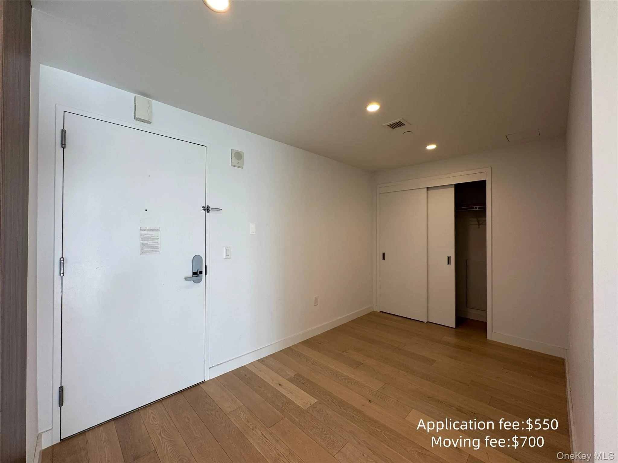 Entrance foyer with recessed lighting and light wood-type flooring Entrance foyer with recessed lighting and light wood-type flooring