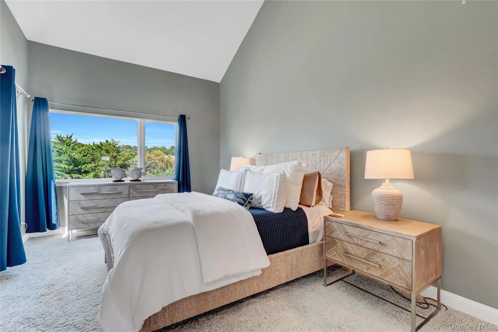 The large windows even offer a view of the water and the high ceilings in the main bedroom makes the space feel large and open. The large windows even offer a view of the water and the high ceilings in the main bedroom makes the space feel large and open.