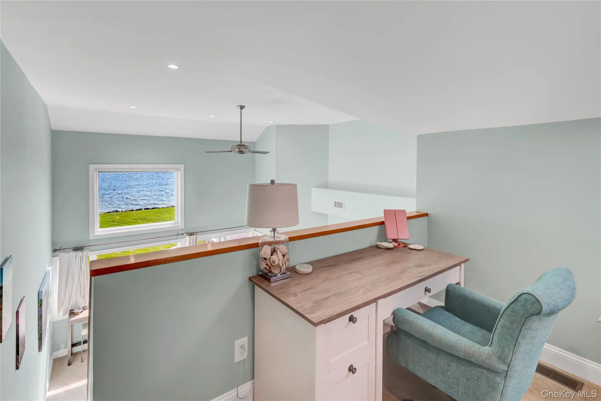 The den has a direct view to the water over the living room. The den has a direct view to the water over the living room.