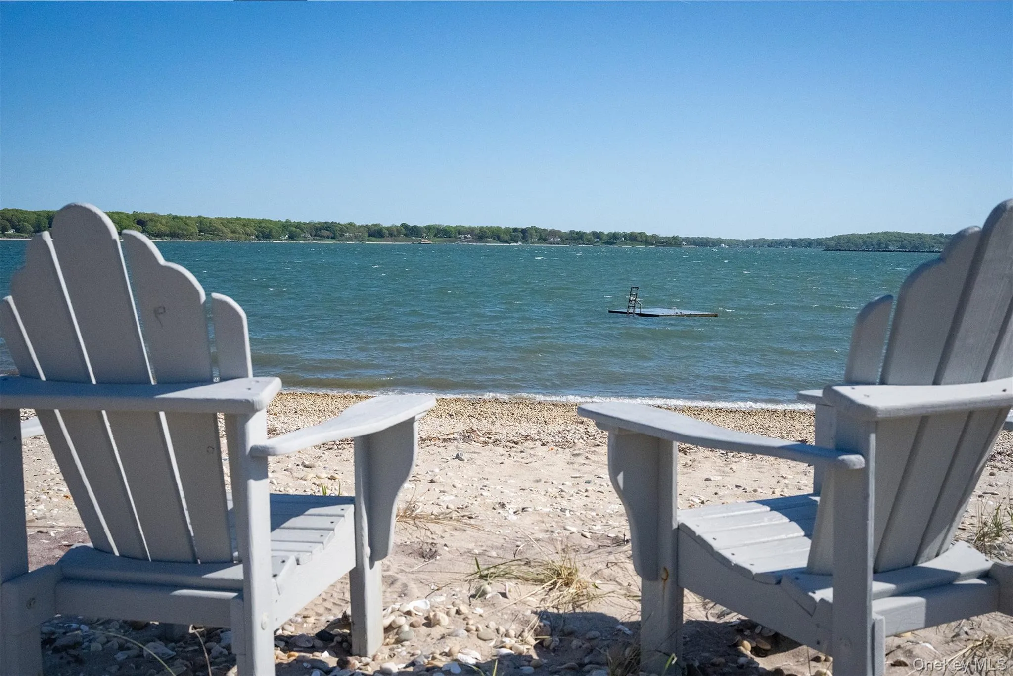 The beach chairs on the sand with the swim platform is great on the summer days when you want to cool off and hang out the the paddle boards. The beach chairs on the sand with the swim platform is great on the summer days when you want to cool off and hang out the the paddle boards.
