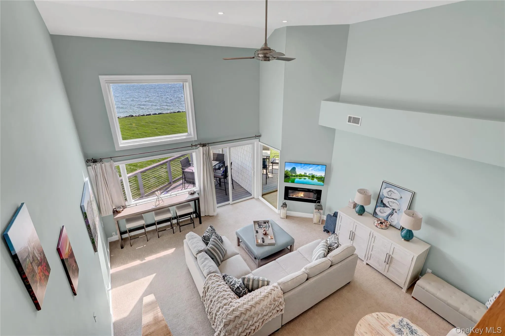 Shows how the double height tall ceilings in the living room creates an open and comfortable environment. Shows how the double height tall ceilings in the living room creates an open and comfortable environment.