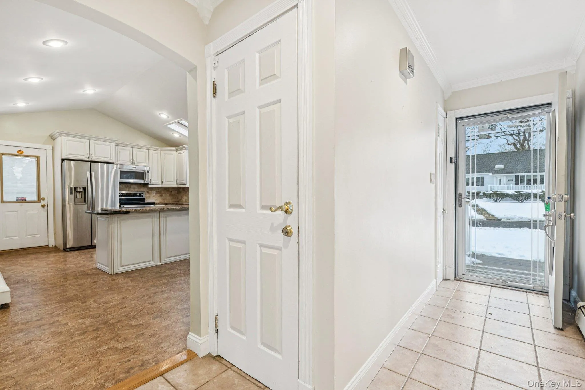 Entry Hallway to the Living Room, Kitchen and Basement Entry Hallway to the Living Room, Kitchen and Basement