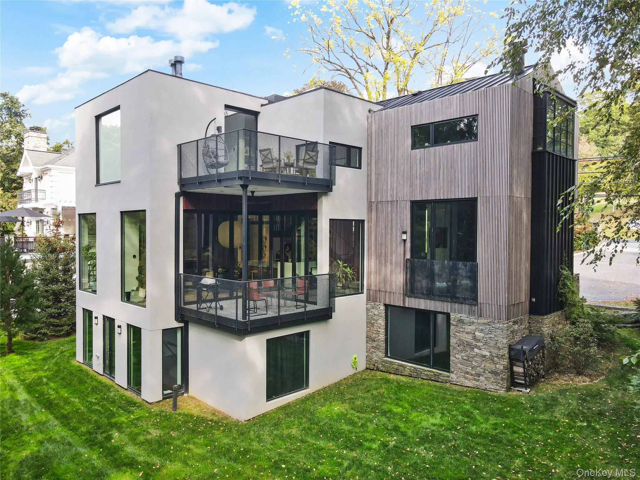 Rear Exterior – Clean-lined design with expansive glass and private, landscaped surroundings. Rear Exterior – Clean-lined design with expansive glass and private, landscaped surroundings.