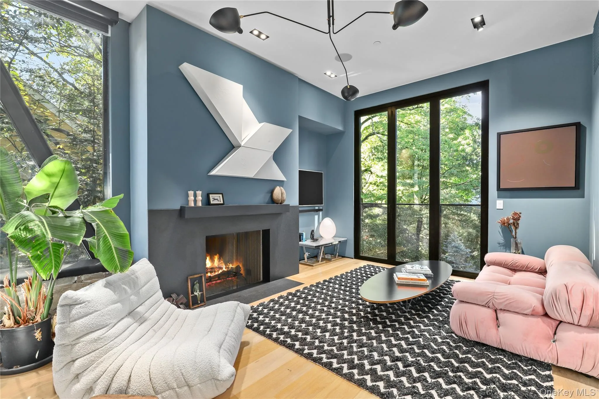 Primary Sitting Area – Cozy lounge with fireplace and refined modern finishes. Primary Sitting Area – Cozy lounge with fireplace and refined modern finishes.