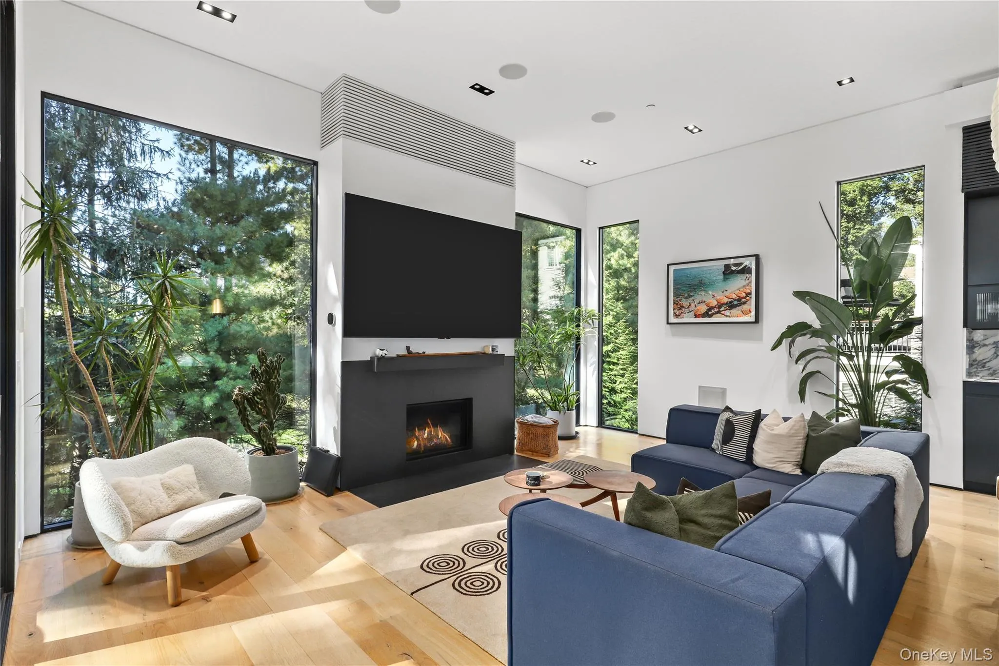 Living Room – Gas fireplace with stone mantel and built-in media wall. Living Room – Gas fireplace with stone mantel and built-in media wall.