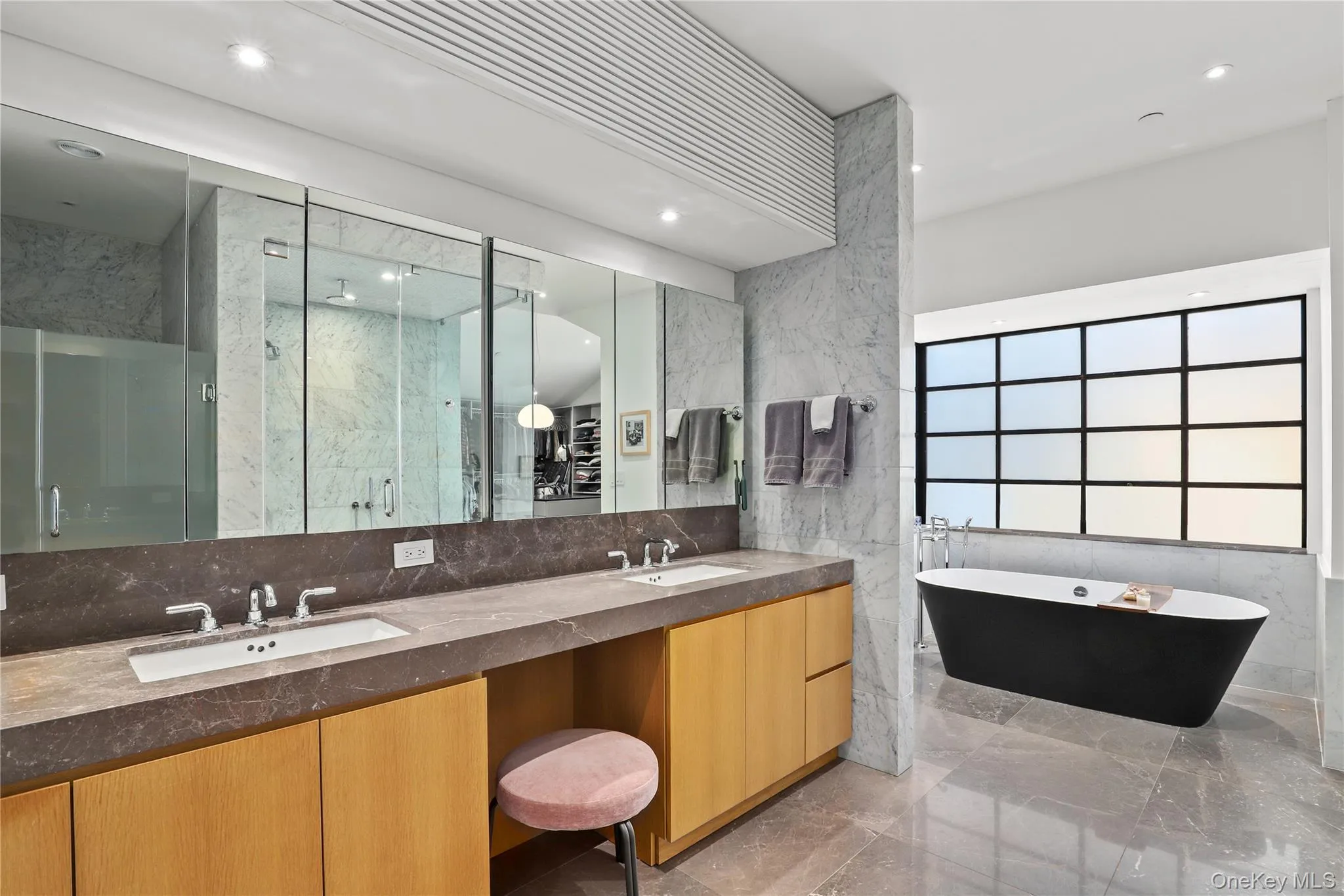 Soaking Tub – Freestanding tub set beneath large windows for a resort feel. Soaking Tub – Freestanding tub set beneath large windows for a resort feel.