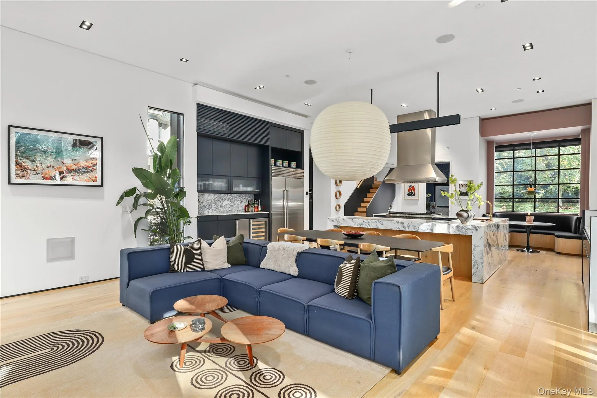 Bright, airy living spaces framed by black steel casement windows and natural light. Bright, airy living spaces framed by black steel casement windows and natural light.