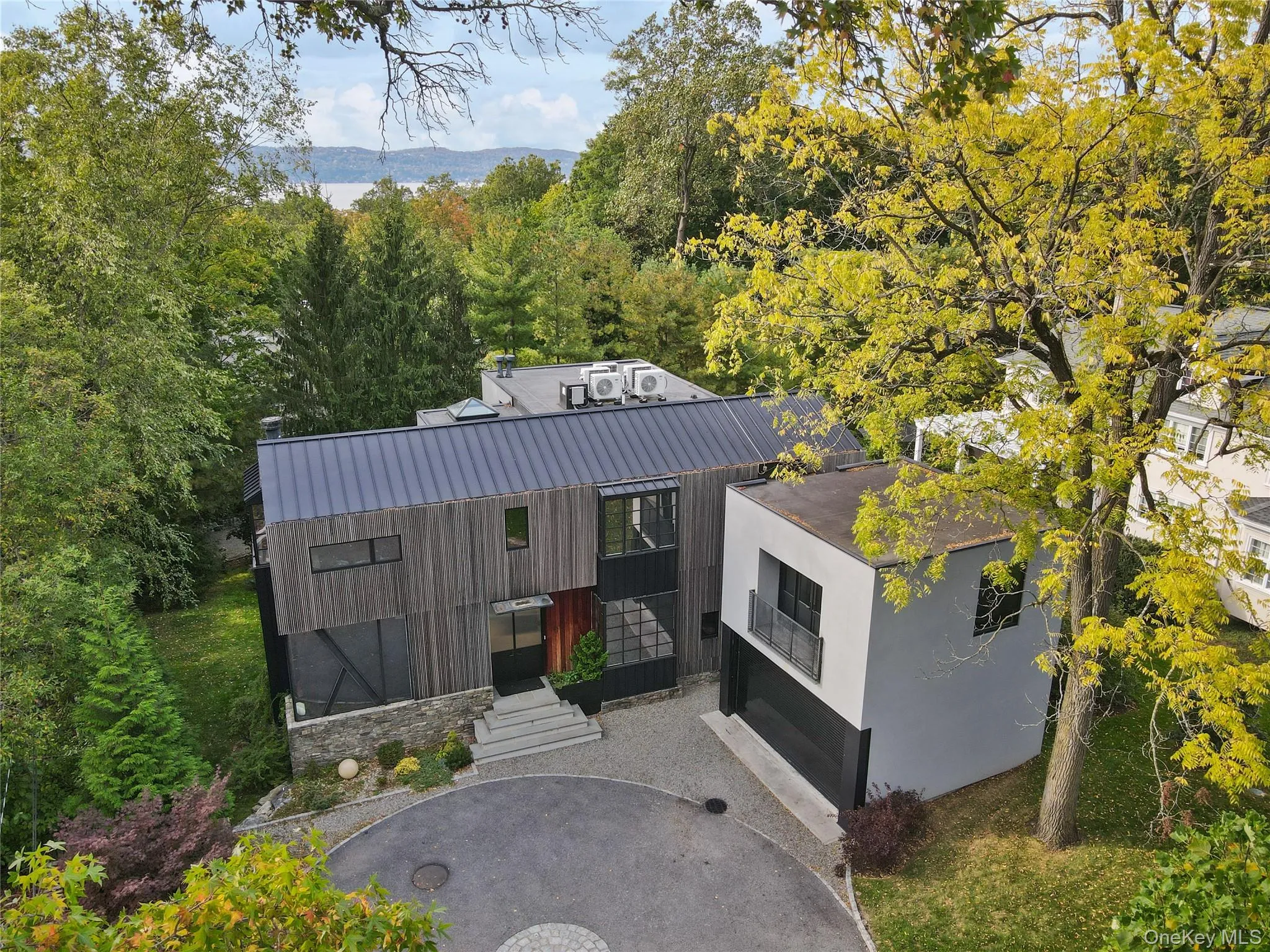 Aerial View – Serene setting among mature trees, minutes to Irvington village. Aerial View – Serene setting among mature trees, minutes to Irvington village.