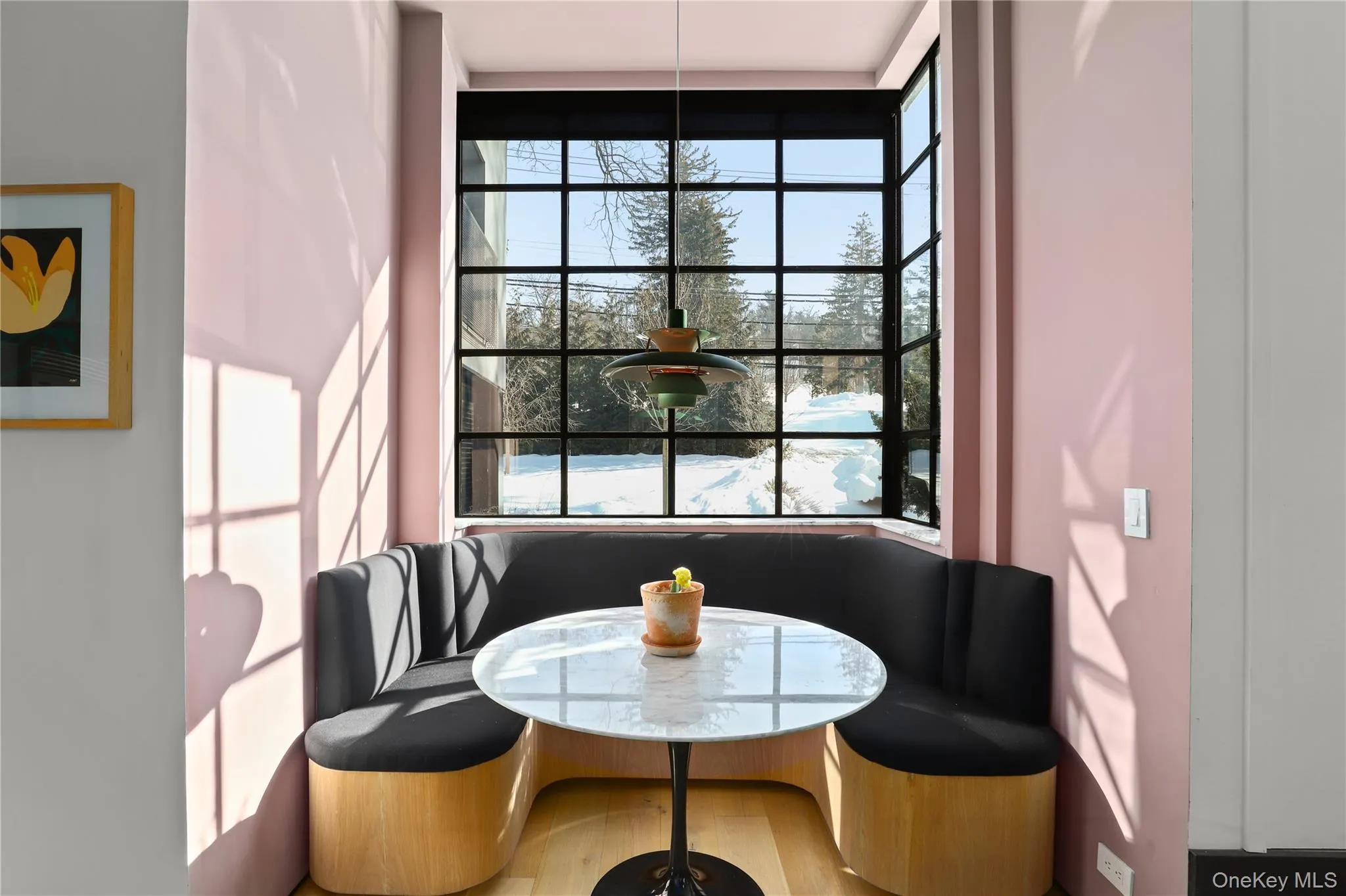 Breakfast Nook – Sunlit nook with custom banquette and designer lighting. Breakfast Nook – Sunlit nook with custom banquette and designer lighting.