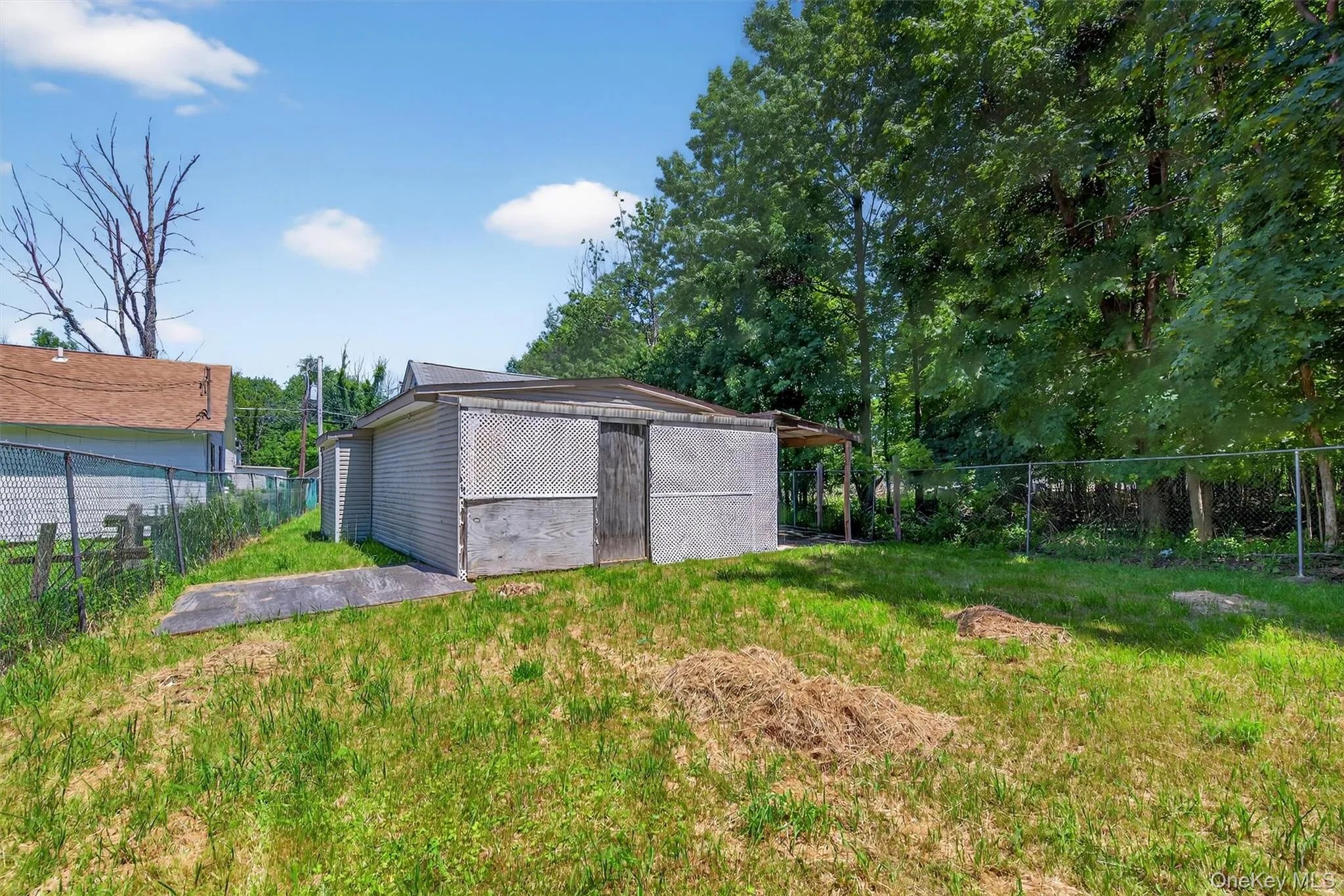 View of yard featuring an outbuilding View of yard featuring an outbuilding